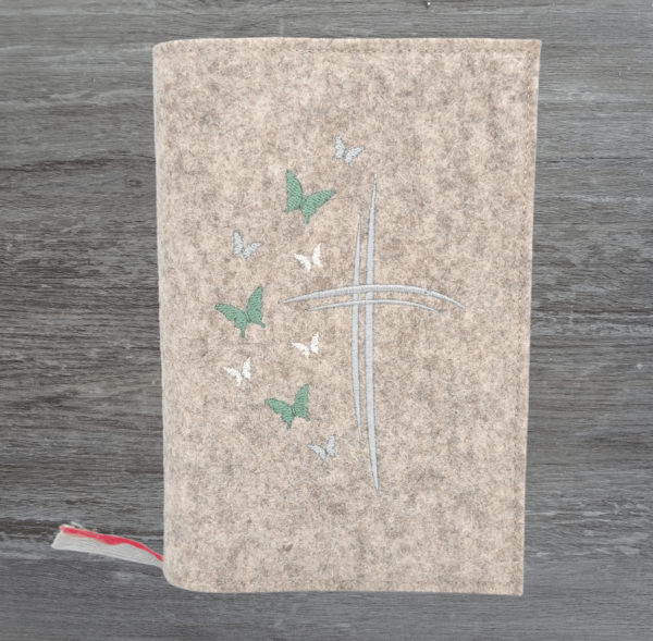 Gotteslobhülle in beige meliert, Kreuze, Schmetterlinge